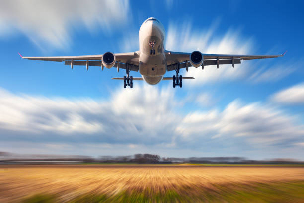 istock Airplane with motion blur effect. Landscape with passenger airplane is flying in the blue sky with blurred clouds at sunset. Travel background. Passenger airliner. Business trip. Commercial aircraft 803794758