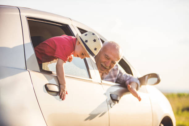 istock Grandather and grandson in the car 803800682