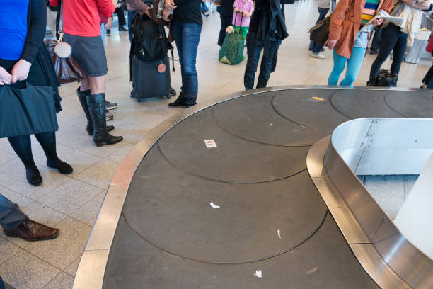 istock Passengers arriving and the conveyor belt 803808654