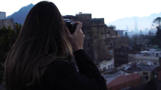 istock Female photographing at morning 803809366