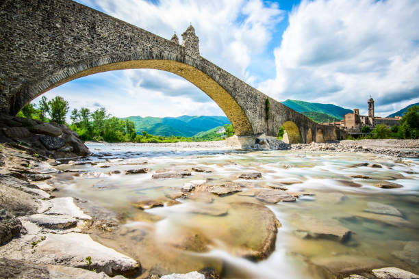 ancient medieval bridge and village Bobbio stock photo