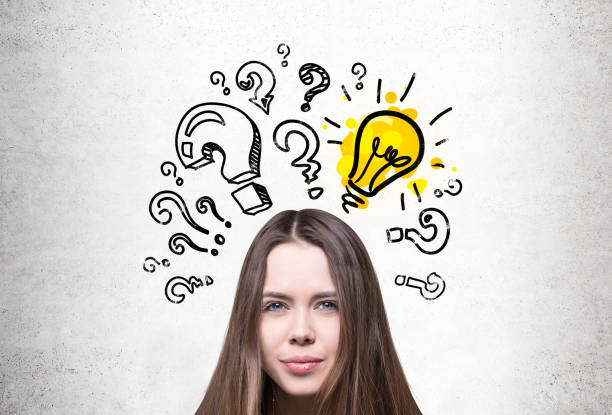 istock Young girl, light bulb and questions 803824386