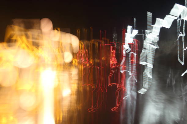 istock Car lights on the streets at night and blurry. 803828610