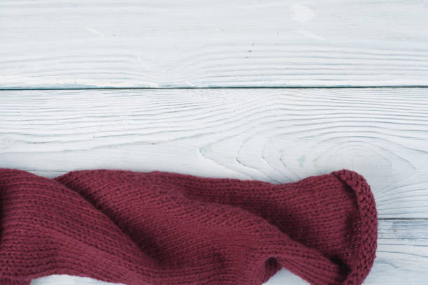 istock Sweater or scarf fabric texture large knitting. Knitted jersey background with a relief pattern. Wool hand- machine, handmade 803829516