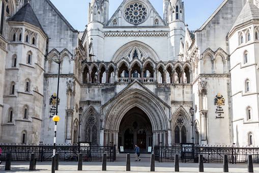 Westminster Abbey Cathedral in London England during the Day Blue Sky and Clouds