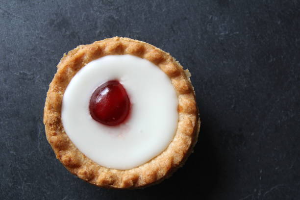 Cherry bakewell tart on dark background Cherry bakewell tart on dark background bakewell photos stock pictures, royalty-free photos & images