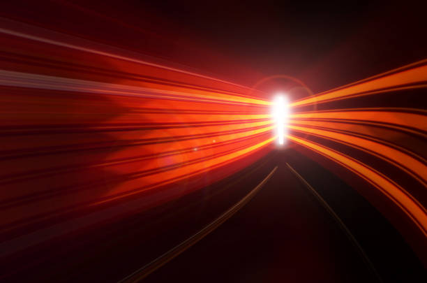 Abstract speed motion in highway road tunnel, blurred motion toward the central