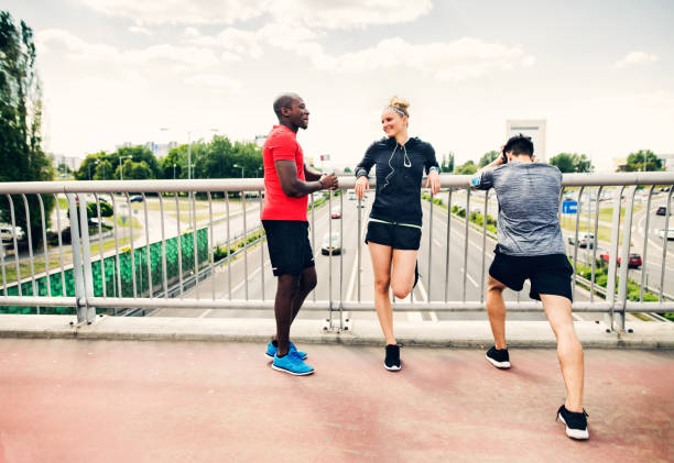 istock Young runners in the city resting on a bridge. 803859702