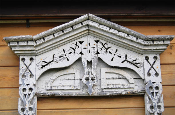 istock Clypeus on the window of the Russian hut, ancient 803863154