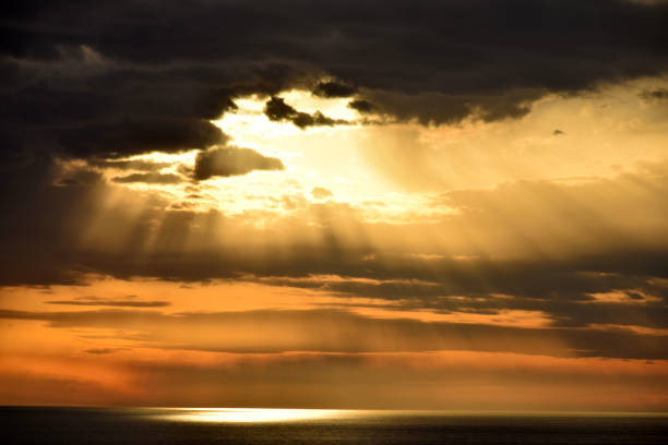 istock Sunset above the open sea, with cloudy sky 803872070