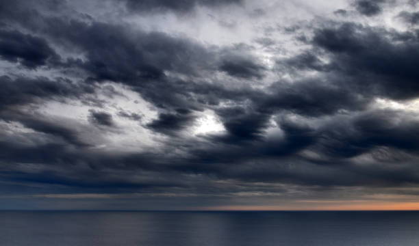 istock Sunset above the open sea, with cloudy sky 803872120