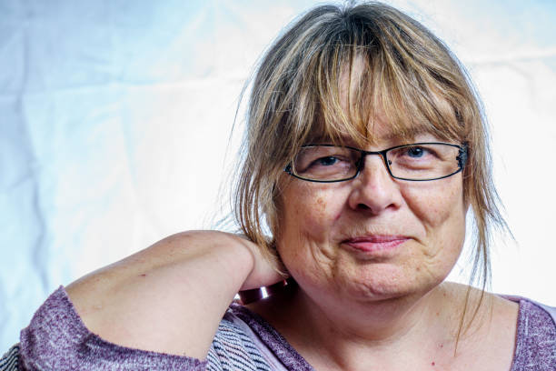 istock Mature woman studio portrait 803878392