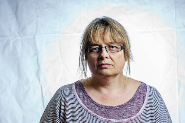 istock Mature woman studio portrait 803879192