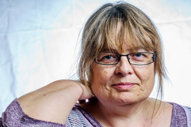 istock Mature woman studio portrait 803879356