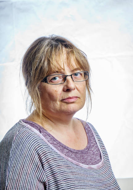istock Mature woman studio portrait 803879550