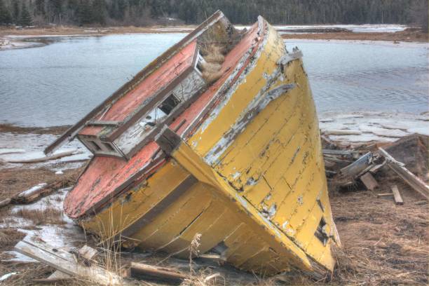 istock Old fishing boat beached and abandoned. 803891908