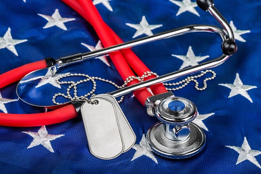 Blank Dog Tags and Stethoscope on American Flag