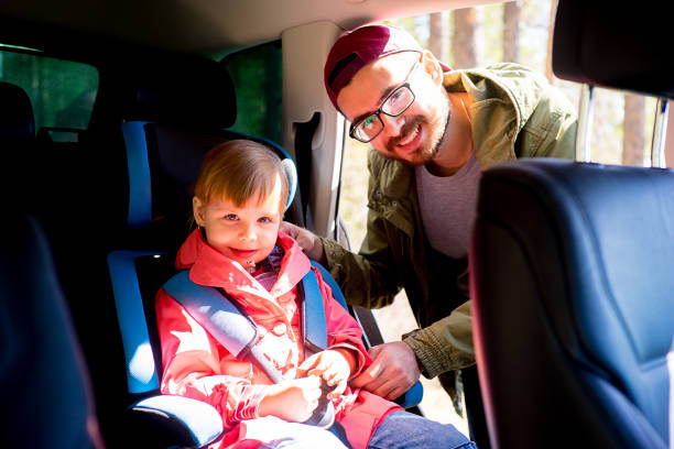 istock Father adjusting baby seat 803896430