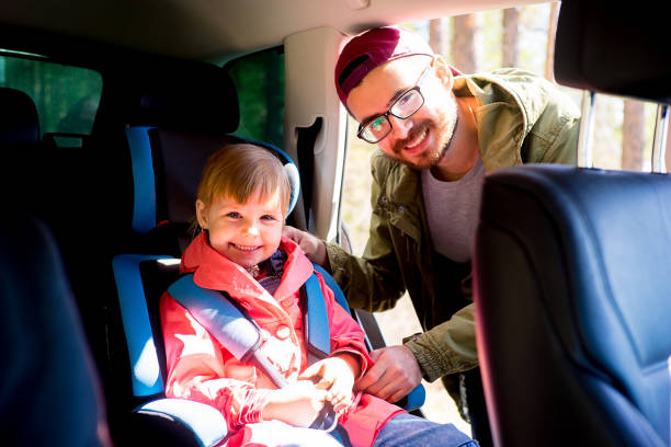 istock Father adjusting baby seat 803896512
