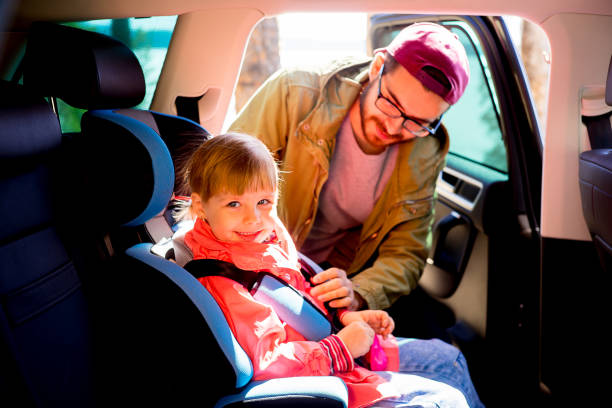 istock Father adjusting baby seat 803896678
