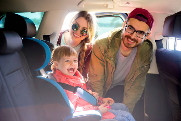 istock Parents adjusting baby seat 803896914