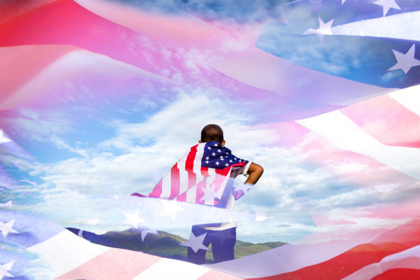 istock kid with American flag. USA celebrate 4th July. 803906372