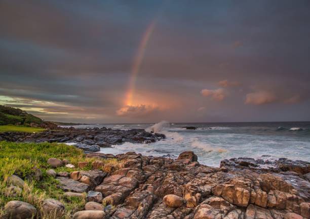 istock Rainbow over the indian ocean at the Wild Coast 803912032