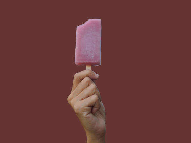 istock isolated grape ice cream in hand on purple background 803914118