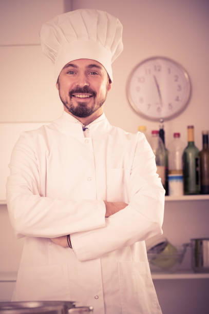 istock Male cook preparing food 803920070