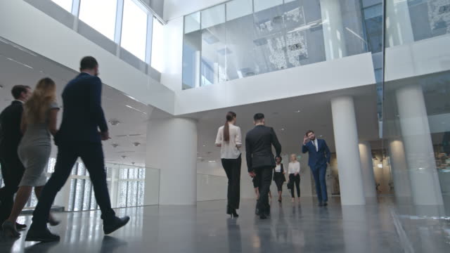 Businesspeople Walking in Business center
