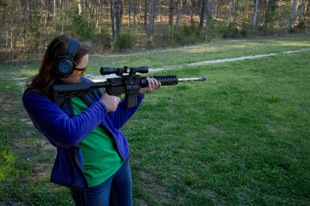 istock Teenage girl at shooting range 803933768
