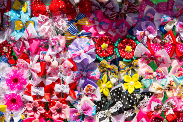 Beautiful and colorful hair clips for kids and teens on a blue background.