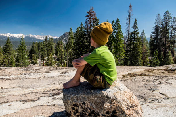 Boy fishing in Edison, Ward, and Florence Lakes; part of the Kaiser WIlderness Area.