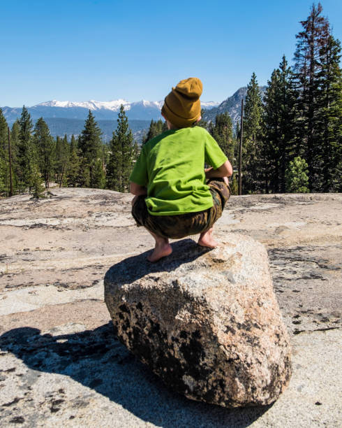 Boy fishing in Edison, Ward, and Florence Lakes; part of the Kaiser WIlderness Area.