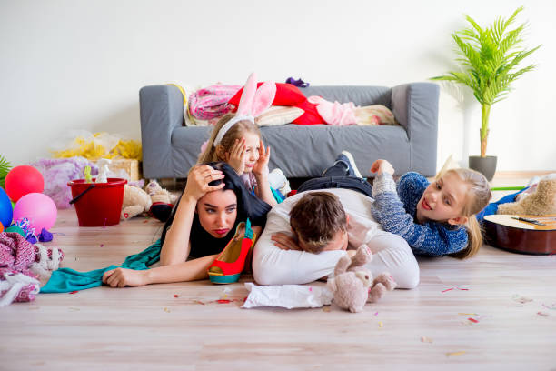 istock Tired parents and romping kids 803940112