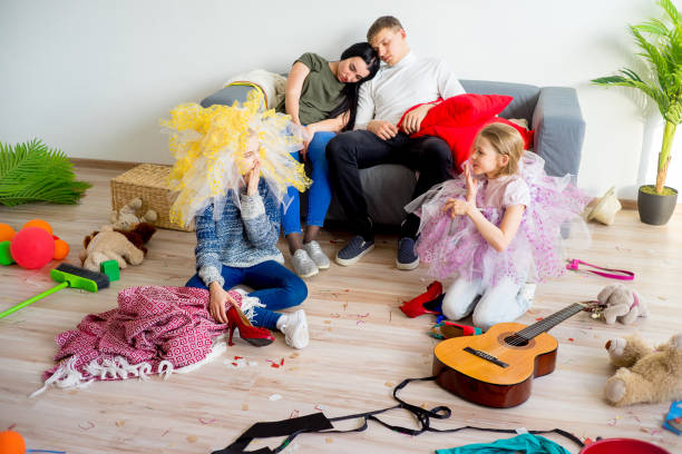 istock Parents sleeping in a middle of a mess 803941058