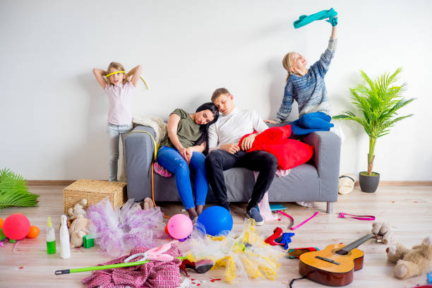 istock Parents sleeping in a middle of a mess 803941112