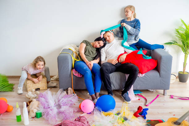 istock Parents sleeping in a middle of a mess 803941196