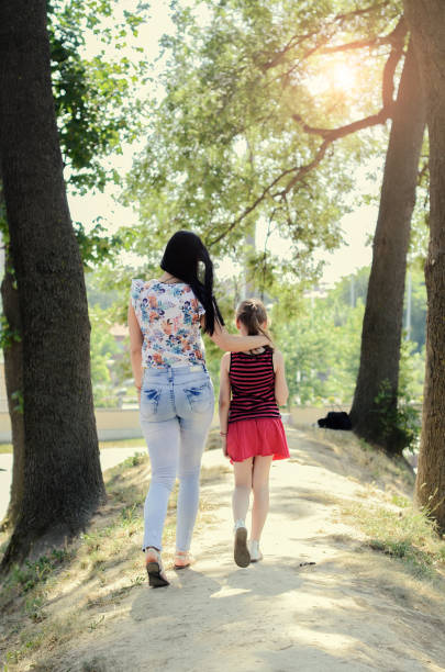 istock Mother and daughter walk 803943756