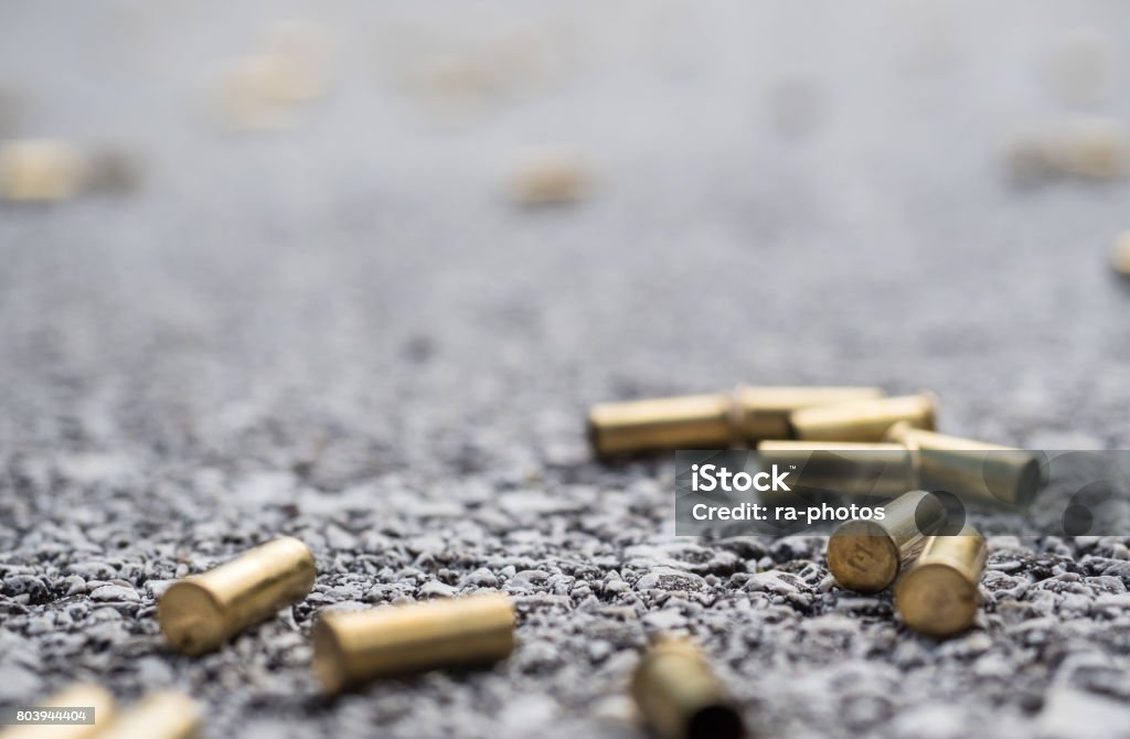 Bullet casings Bullet casings on the street Bullet Stock Photo