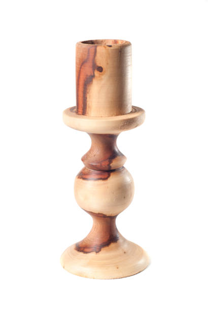 istock wooden candlestick Isolated on white background 803949490