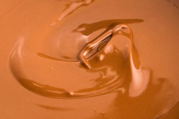 istock Background of melted milk chocolate 803949824