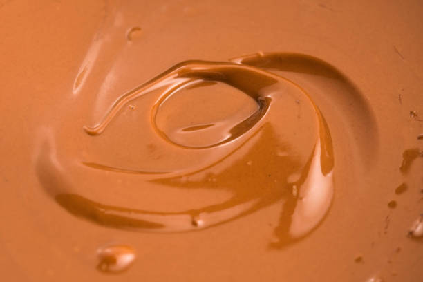 istock Background of melted milk chocolate 803949884