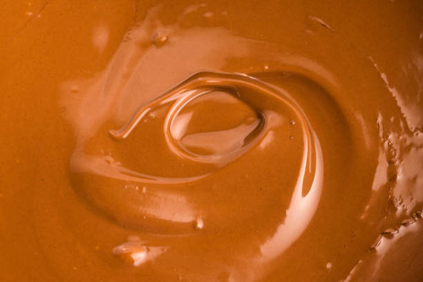 istock Background of melted milk chocolate 803949902