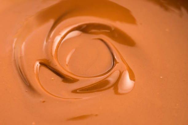 istock Background of melted milk chocolate 803953752