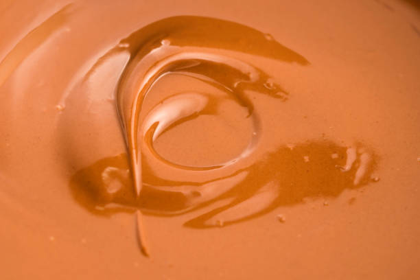 istock Background of melted milk chocolate 803961120