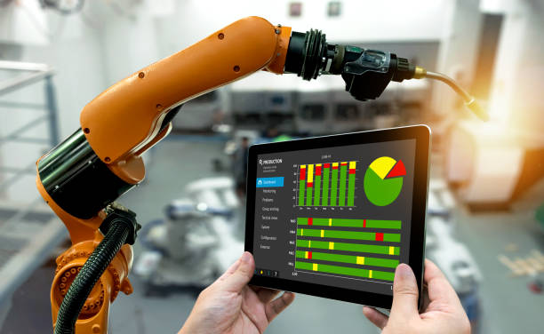 istock Engineer manager hand using tablet, heavy automation robot arm machine in smart factory industrial with tablet real time monitoring production system. Industry 4th iot concept. Flare light effect. 803972332