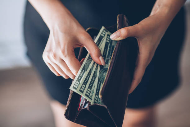 istock Woman is taking out money from wallet 803997954