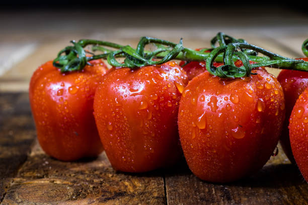 Rosa on tasty Italian tomatoes, wooden table