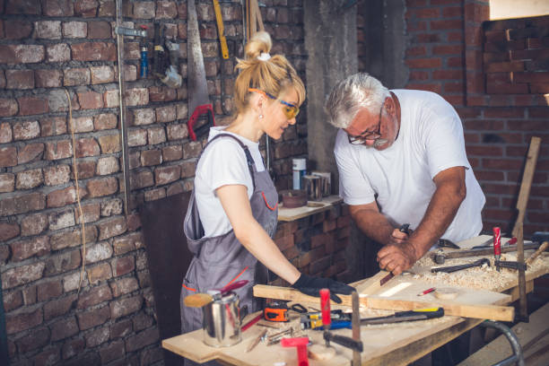 istock Female craftsman,in her workshop with her father 804017384
